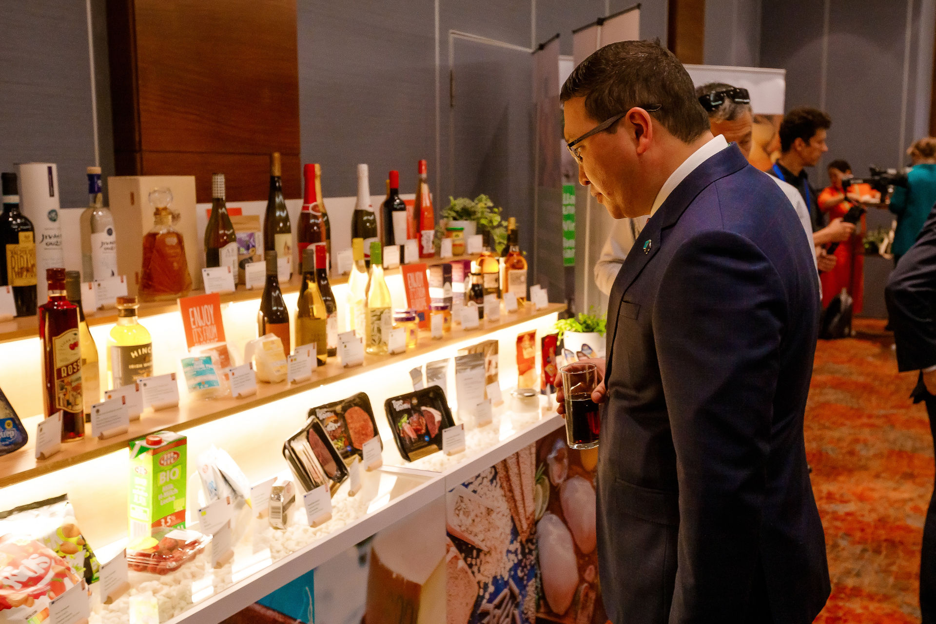a man viewing a display of EU food and drink products