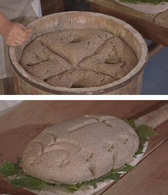 leavened dough in a oak trough and a loaf on a bakers paddle